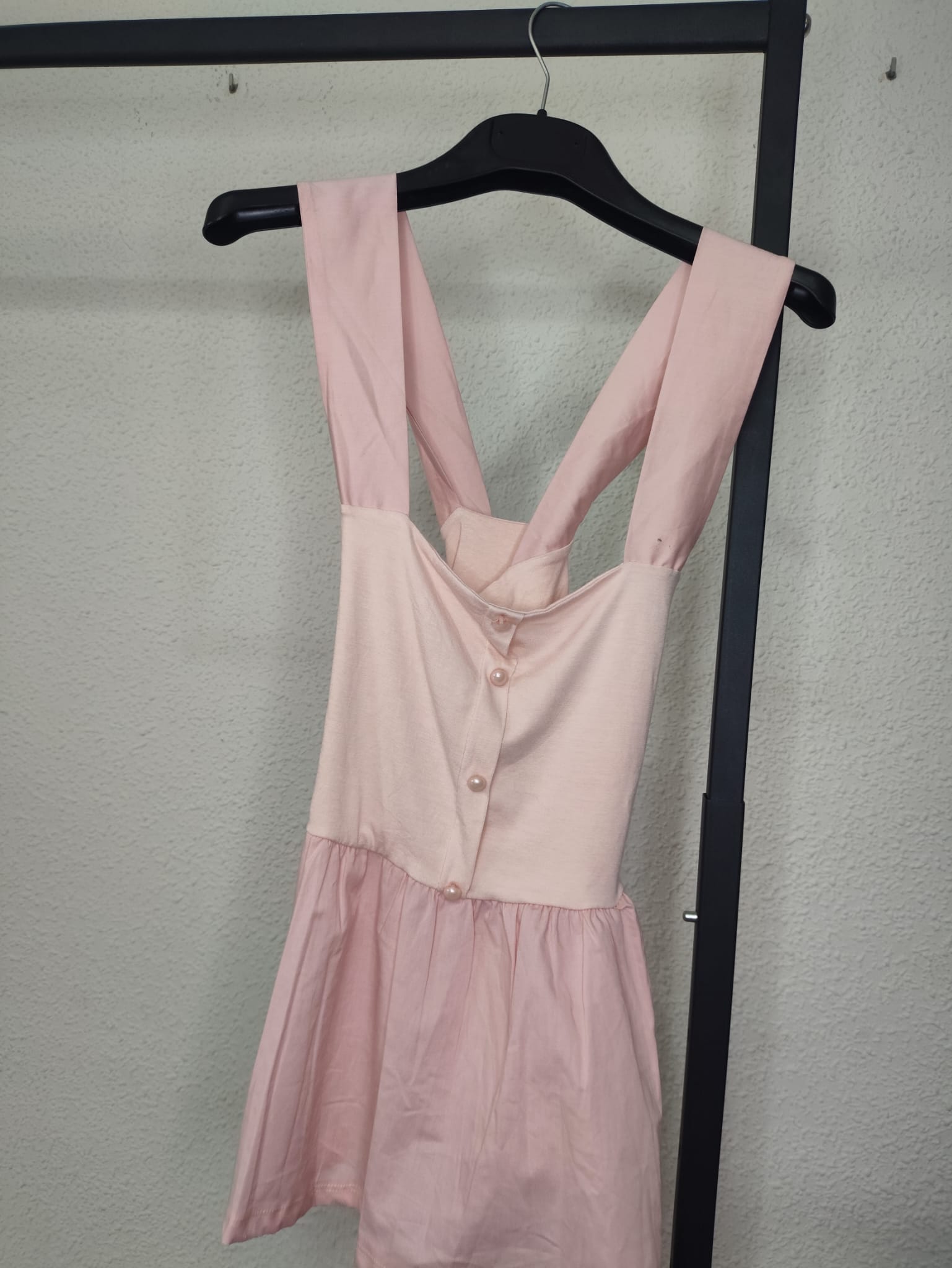 Top Perla Peplum rosa - vista en percha